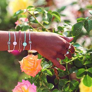 hand wearing jewelry flowers